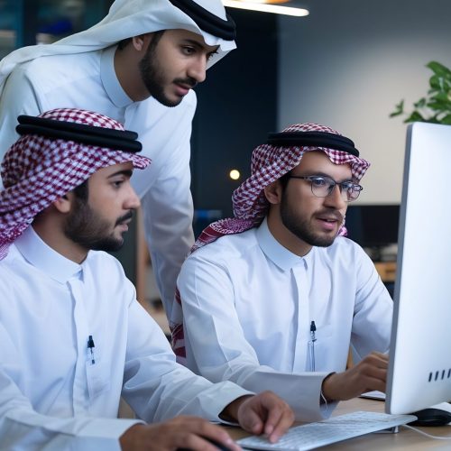 young-team-arab-specialists-working-computers-having-conversation-workplace